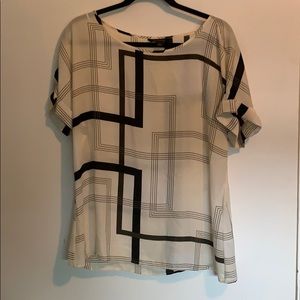 Geometric top with cuffed sleeves